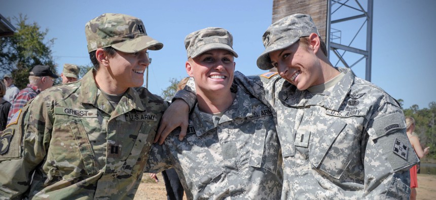 From left, U.S. Army Capt. Kristen Griest, Maj. Lisa Jaster and 1st Lt. Shaye Haver share a moment following Jaster's graduation from Ranger School on Fort Benning, Ga., Oct. 16, 2015.