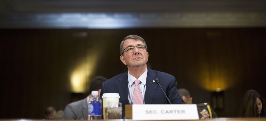 Defense Secretary Ash Carter arrives on Capitol Hill in Washington, Wednesday, Dec. 9, 2015, to testify before the Senate Armed Service Committee hearing on the Islamic State.