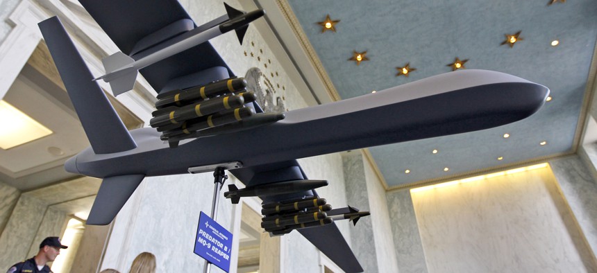A model of the General Atomics Predator B MQ-9 Reaper, unmanned aerial vehicle (UAV), is on display in the Rayburn House Office Building on Capitol Hill in Washington Wednesday, Sept. 22, 2010.
