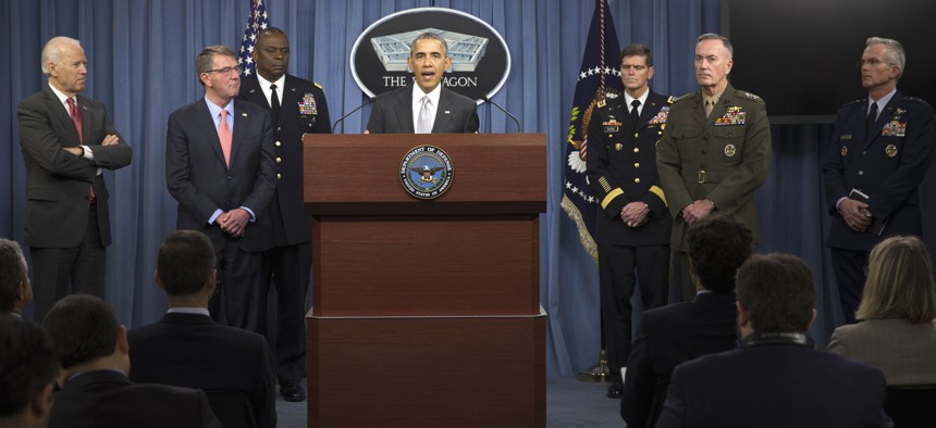 President Barack Obama, accompanied by Defense Secretary Ash Carter and Commander of U.S. Central Command Gen. Lloyd Austin, speaks at the Pentagon, Monday, Dec. 14, 2015.
