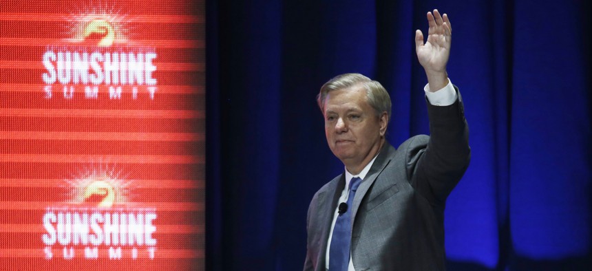 Republican presidential candidate, Sen. Lindsey Graham, R-SC, waves to the audience after addressing the Sunshine Summit in Orlando, Fla., Friday Nov. 13, 2015.