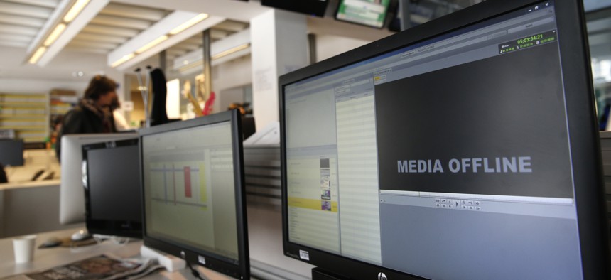 Computer screens are pictured at TV5 Monde after the French television network was hacked by people claiming allegiance to the Islamic State group, in Paris, France, Thursday April 9, 2015.