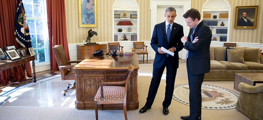 President Barack Obama talks with Press Secretary Josh Earnest in the Oval Office, Feb. 3, 2015. 