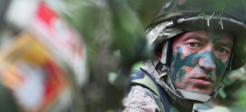 Montenegrin army Sgt. Radomir Drobac takes position as he waits for the opposing force in an ambush exercise during the Immediate Response 2012 training event held in Slunj, Croatia on Friday, June 1, 2012.