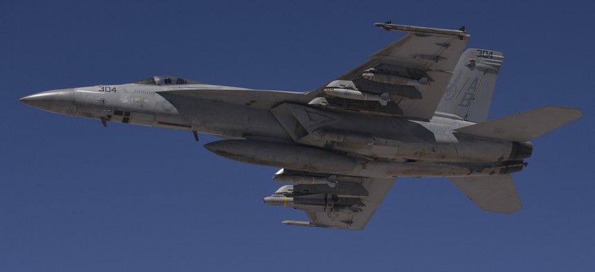 A U.S. Navy F/A-18F Super Hornet flies a combat sortie over Iraq July 2, 2015.