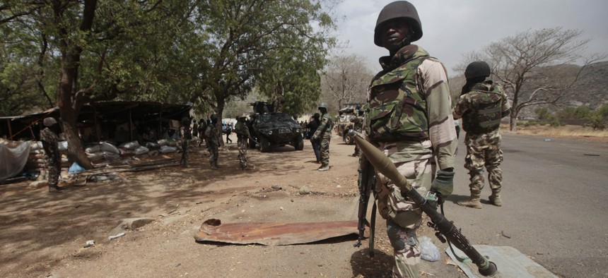 Nigerian soldiers man a checkpoint in Gwoza, Nigeria, a town newly liberated from Boko Haram, April 8, 2015.