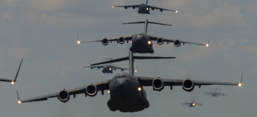 U.S. Airmen from Joint Base Charleston, S.C., conduct a multi-ship C-17 Globemaster III formation on May 21, 2015.