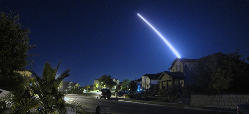 An operational test launch of an unarmed Minuteman III intercontinental ballistic missile from Vandenberg Air Force Base, Calif., is seen from nearby Lompoc, Calif., Sept. 26, 2013. 