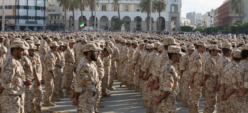 Military units which operate under the Tripoli government stand in formation during a celebration of the 75th anniversary of the establishment of the Libyan Army in Martyrs Square, Tripoli, Libya, August 2015.