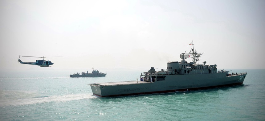 Iran's Jamaran guided-missile destroyer, is seen at right, in an exercise, in the Persian Gulf, Iran, Sunday, Feb. 21, 2010.