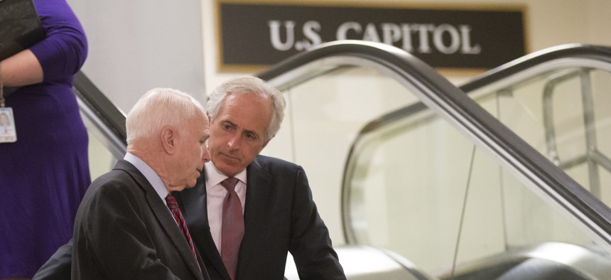 Sen. John McCain, R-Ariz., left, and Sen. Bob Corker, R-Tenn., right, at the Capitol in Washington, Tuesday, Sept. 17, 2013. 