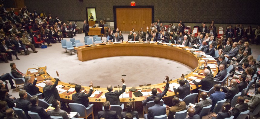 A gathering of global financial ministers vote together for the first time on a anti-terrorism resolution in the U.N. Security Council, Thursday, Dec. 17, 2015 at U.N. headquarters.