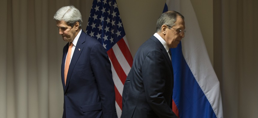 U.S. Secretary of State John Kerry, left, and Russian Foreign Minister Sergey Lavrov walk to their seats for a meeting about Syria, in Zurich, Switzerland, on Wednesday, Jan. 20, 2016.