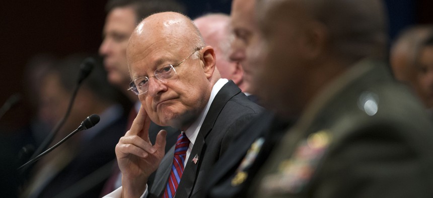 Director of National Intelligence James Clapper listens at center to testimony given by Director of the Defense Intelligence Agency, Lt. Gen. Vincent Stewart, far right, during the House Intelligence Committee hearing on Capitol Hill, Sept. 10, 2015.