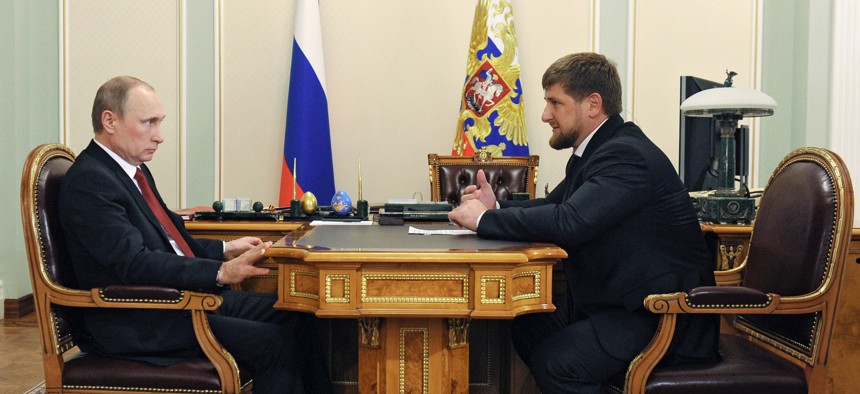 Russian President Vladimir Putin, left, listens to Chechnya's regional leader Ramzan Kadyrov during a meeting at the Novo-Ogaryovo residence outside Moscow, Russia, Monday, April 7, 2014.