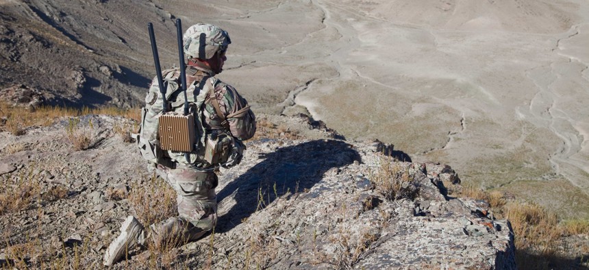 A U.S. Soldier of Bandit Troop 1st (Tiger) Squadron 3rd Cavalry Regiment provides overwatch security while soldiers move up Pride Rock mountain to witness the reenlistment of two U.S. Soldiers in Paktya province, Afghanistan.