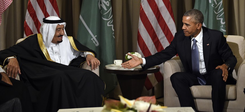U.S President Barack Obama reaches out to shake hands with King Salman of Saudi Arabia at the G-20 Summit in Antalya, Turkey, Sunday, Nov. 15, 2015. 