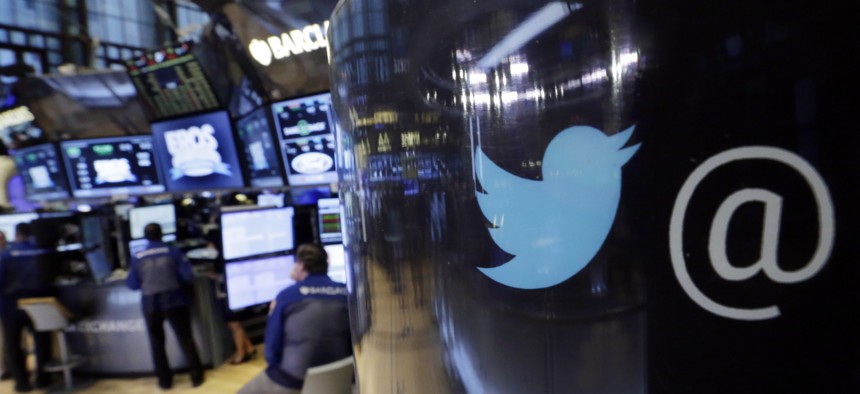 The Twitter logo appears on a phone post on the floor of the New York Stock Exchange, Oct. 13, 2015.