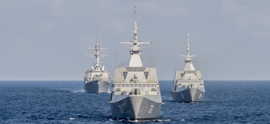 The Republic of Singapore Navy’s RSS Intrepid (69), right, RSS Supreme (73), center, and the U.S. Navy destroyer USS Lassen (DDG 82), left, during a military drill in the South China Sea.