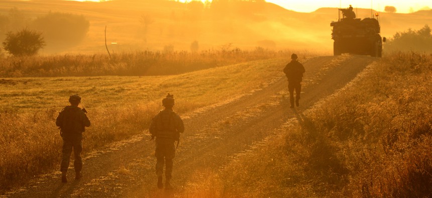 U.S. Army soldiers from the 2nd Cavalry Regiment, patrol a road at the Grafenwoehr Training Area during Exercise Saber Junction 12 in 2012.
