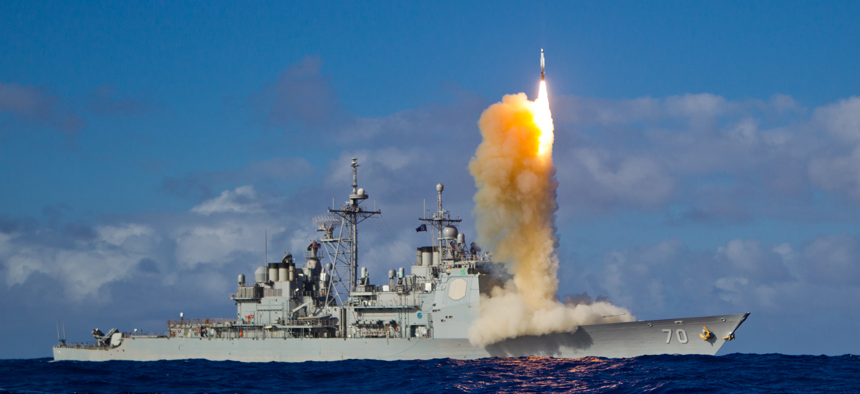 The cruiser Lake Erie, the Aegis Ballistic Missile Defense (BMD) test ship, fires a Standard missile.