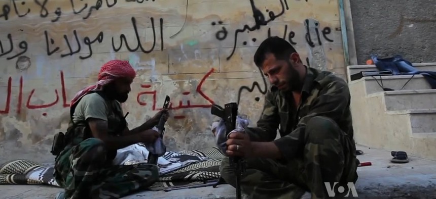 Free Syrian Army rebels clean their weapons in Aleppo, Syria, in this file photo from 2012.