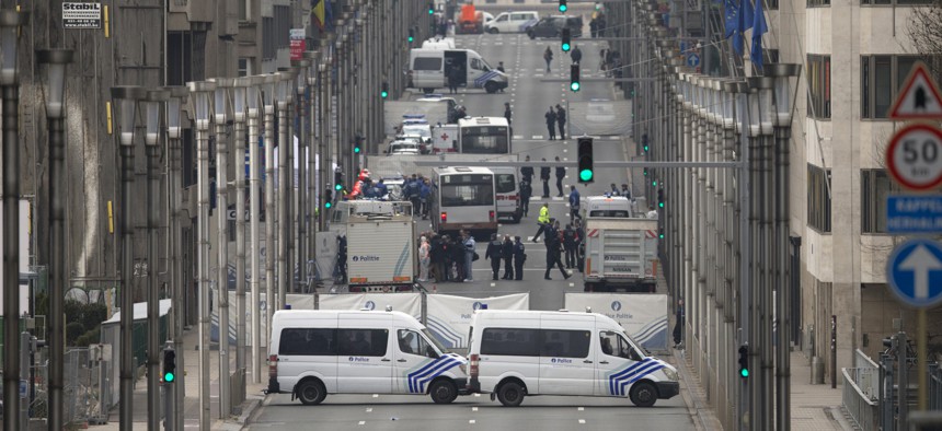 Emergency services and police work around a metro station after an explosion in Brussels on Tuesday, March 22, 2016.