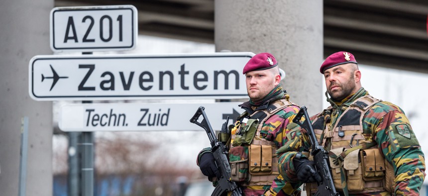 Belgian Army soldiers patrol at Zaventem Airport in Brussels on Wednesday, March 23, 2016. 