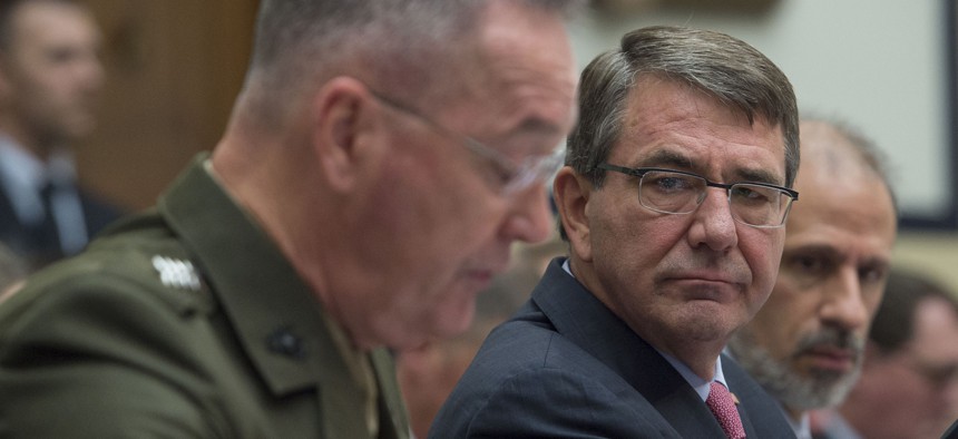 Defense Secretary Ash Carter listens as chairman of the Joint Chiefs of Staff Gen. Joseph Dunford testifies before the House Armed Services Committee on March 22, 2016.