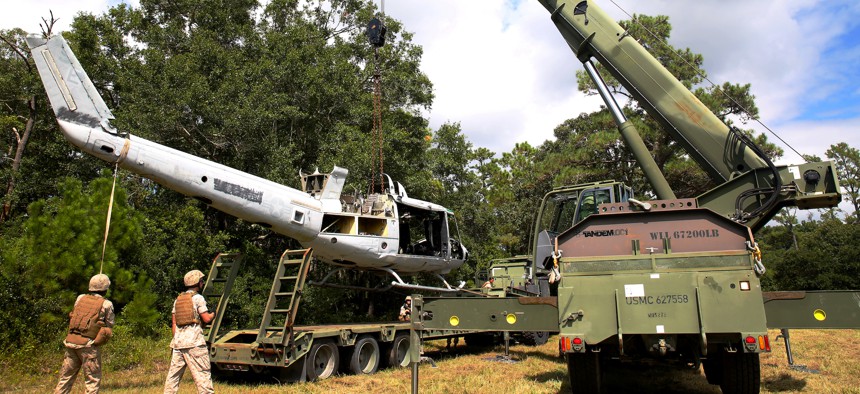 U.S. Marines use a Terex-Demag MAC-50 crane to lifts a UH-1N Huey helicopter during training at Marine Corps Base Camp Lejeune, N.C., in 2014.