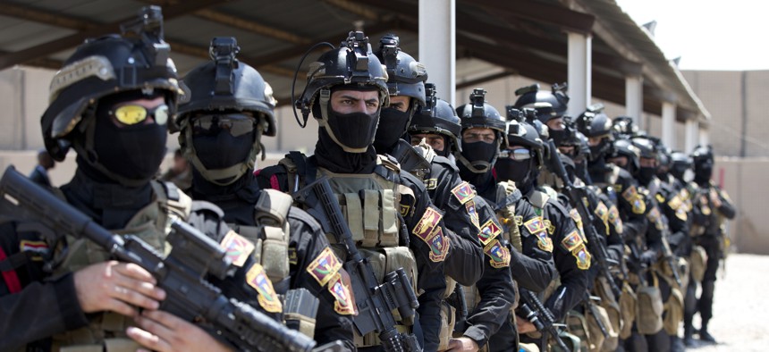 The Iraqi Counter Terrorism Service forces participate in a training exercise as U.S. Defense Secretary Ash Carter observes at its academy on the Baghdad Airport Complex in Baghdad, Iraq, Thursday, July 23, 2015. 