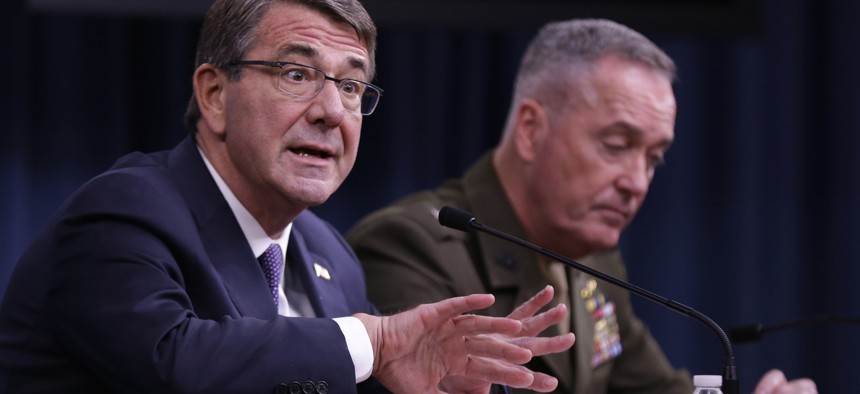 Defense Secretary Ash Carter, accompanied by Joint Chiefs Chairman Gen. Joseph Dunford, speaks during a news conference at the Pentagon, Friday, March 25, 2016.