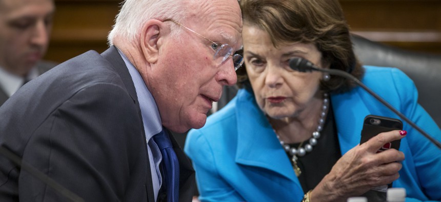 Sen. Patrick Leahy, D-Vt., the ranking member of the Senate Judiciary Committee, left, speaks with Sen. Dianne Feinstein, D-Calif., on Capitol Hill in Washington, March 10, 2016. 