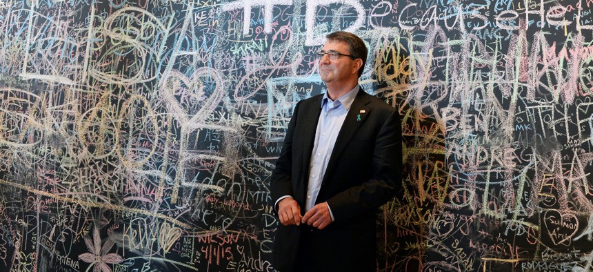 Defense Secretary Ash Carter stands in front of the Facebook wall during his visit to the company’s headquarters in Menlo Park, Calif., April 23, 2015.