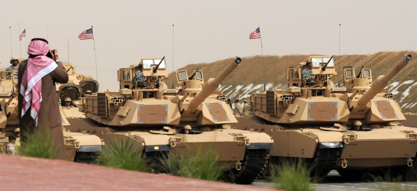 U.S. Army heavy battle tanks are seen during a military parade commemorating the 20th anniversary of the liberation of Kuwait from the 1990 Iraqi invasion in Subiya, Kuwait, Feb. 26, 2011.