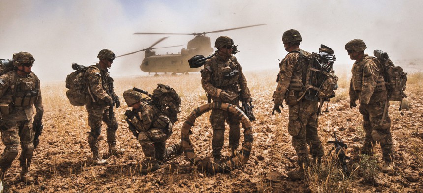 Soldiers of the 82nd Airborne Division prepare to board a CH-47F Chinook in the Nawa Valley, Kandahar Province, Afghanistan, May 25, 2014.