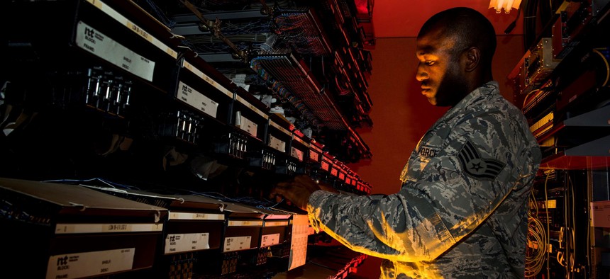 A U.S. Air Force cyber transport systems technician at work Aug. 8, 2013, at Joint Base Charleston, S.C. 