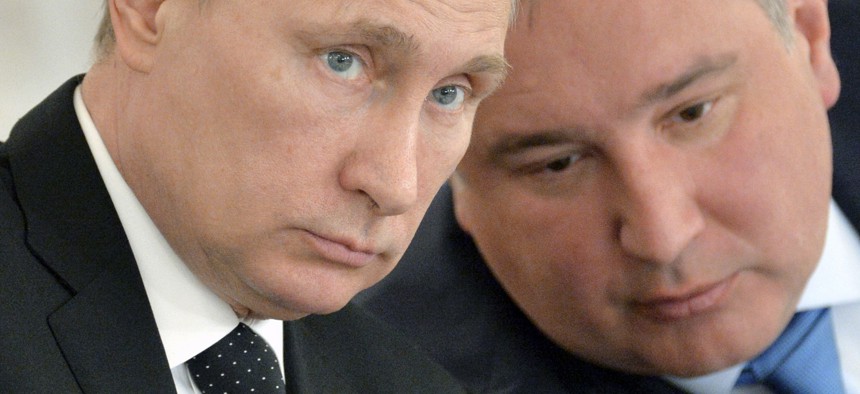 Russian President Vladimir Putin, left, and his defense czar Dmitry Rogozin at the Kremlin last year.