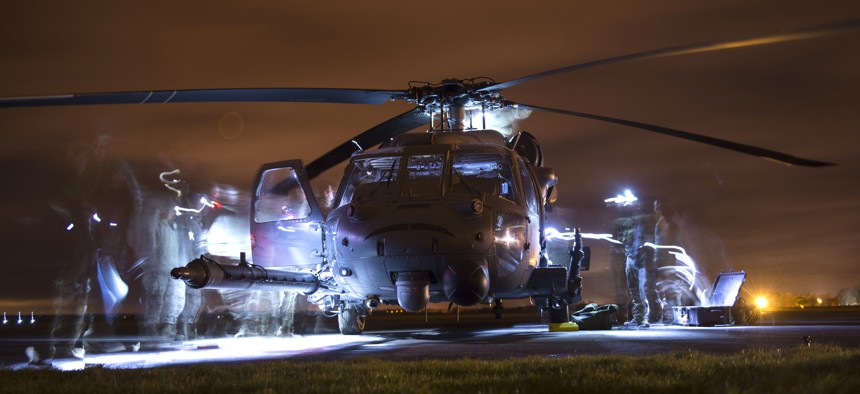 U.S. Airmen conduct post-flight inspections on an HH-60G Pave Hawk during exercise Voijek Valour at Hullavington Airfield, England, March 4, 2016.