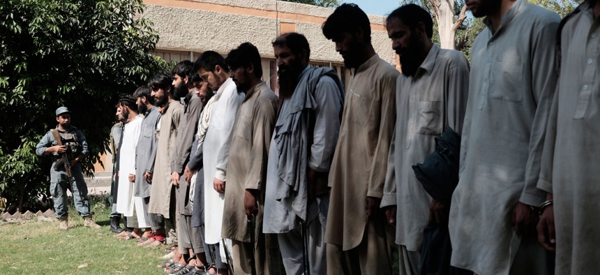 Islamic State fighters, who were arrested by Afghan security personal are presented to the media at the Afghan police headquarters in Jalalabad, east of Kabul, Afghanistan, Monday, May 9, 2016. 