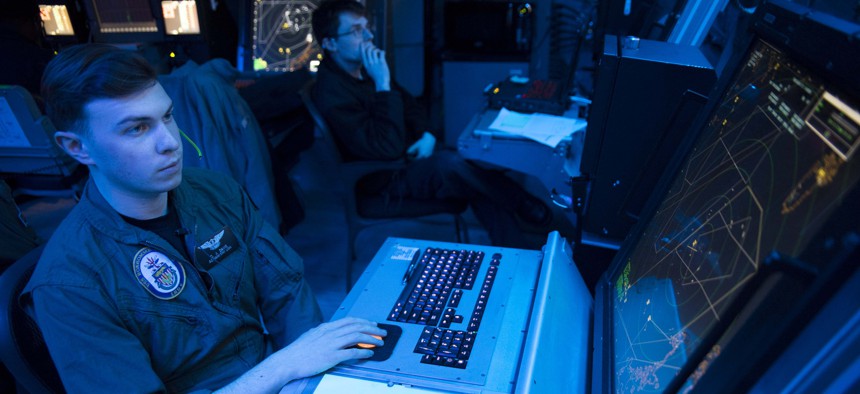 A U.S. sailor simulates an approach control watch in the amphibious air traffic control center aboard the amphibious assault ship USS Bonhomme Richard (LHD 6), somewhere in the U.S. 7th Fleet area of operations, March 20, 2016.
