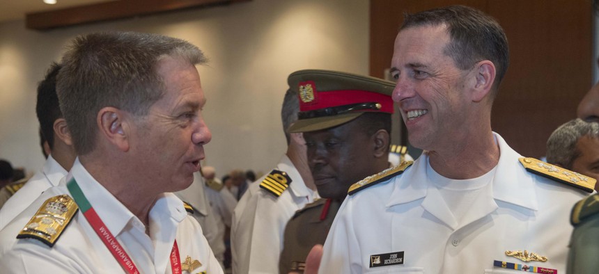 Chief of Naval Operations Adm. John Richardson (CNO) talks with the head of the Royal Australian Navy, Chief of Navy Vice Adm. Tim Barrett, during India's International Fleet Review (IFR) 2016.