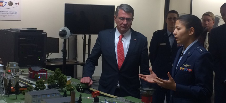Defense Secretary Ash Carter looks over the CberCity simulator at the Air Force Academy, taken May 12, 2016.