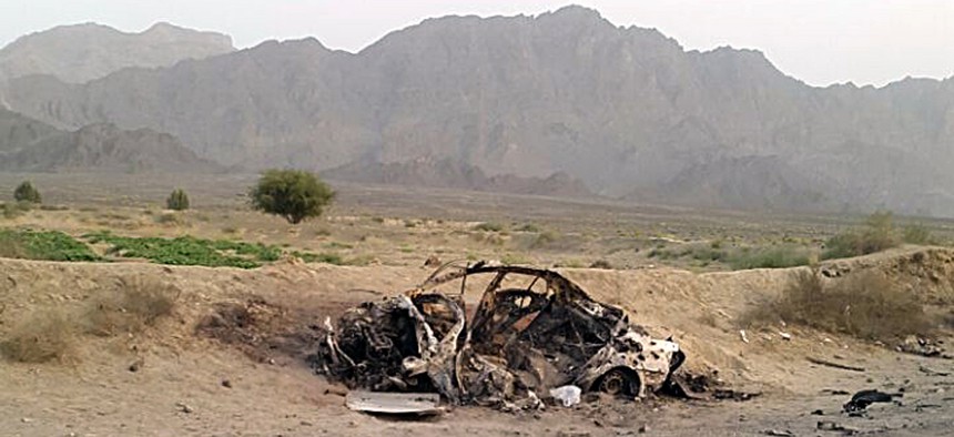 This photo taken by a freelance photographer Abdul Salam Khan using his smart phone on Sunday, May 22, 2016, purports to show the destroyed vehicle in which Mullah Mohammad Akhtar Mansour was traveling in the Ahmad Wal area in Baluchistan, Pakistan.