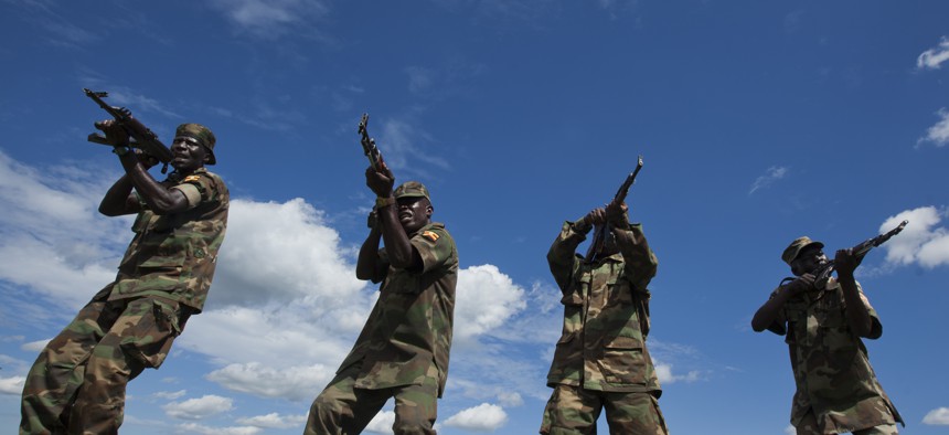 Soldiers from the Uganda People's Defence Force (UPDF) engage in weapons training at the Singo training facility in Kakola, Uganda Monday, April 30, 2012.
