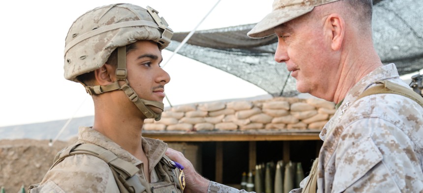 On April 22, Chairman of the Joint Chiefs of Staff Gen. Joseph Dunford presents U.S. Marine Lance Cpl. Javier A. Suarezmontalvo, with a Purple Heart for injuries sustained on March 19 at Kara Soar Base, Makhmur, Iraq. 
