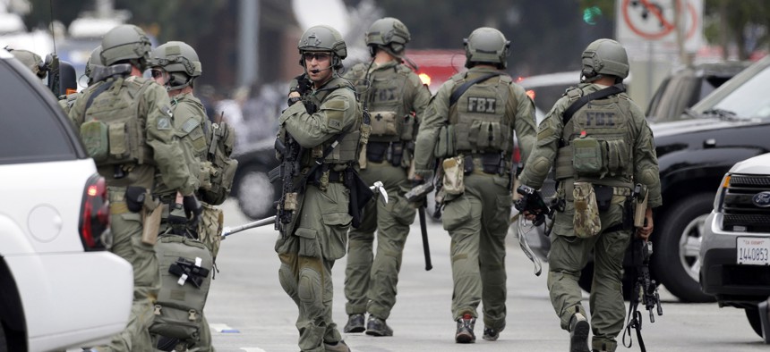 An FBI SWAT team arrives at the scene of a fatal shooting at the University of California, Los Angeles, Wednesday, June 1, 2016, in Los Angeles. 
