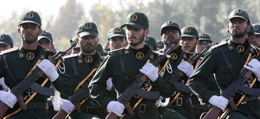 In this picture taken on Sunday, Sept. 21, 2008, Iranian Revolutionary Guards members march during a parade just outside of Tehran.
