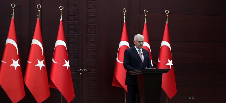 Turkey's Prime Minister Binali Yildirim announces the details of an agreement reached with Israel, in Ankara, Turkey, Monday, June 27, 2016. 