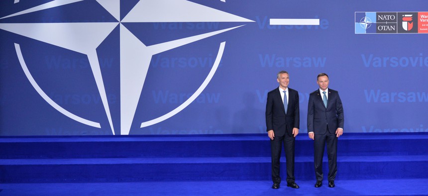 NATO Secretary General Jens Stoltenberg and the President of Poland, Andrzej Duda, pose at the July 8 opening of the NATO Summit in Warsaw.